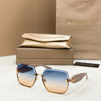 Bvlgari sunglasses with blue-to-brown tinted lenses and gold-toned frame