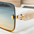 Bvlgari sunglasses close-up of gold-tone side hinge with patterned emblem