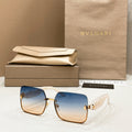 Bvlgari square sunglasses with blue lenses and gold-tone metal frame