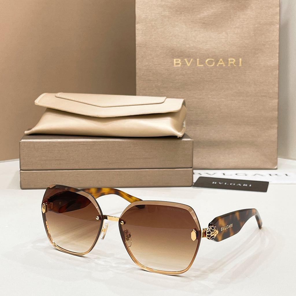 Bvlgari sunglasses with tortoiseshell frames, gold accents, and brown gradient lenses