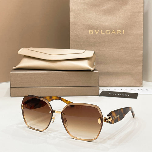 Bvlgari sunglasses with tortoiseshell frames, gold accents, and brown gradient lenses