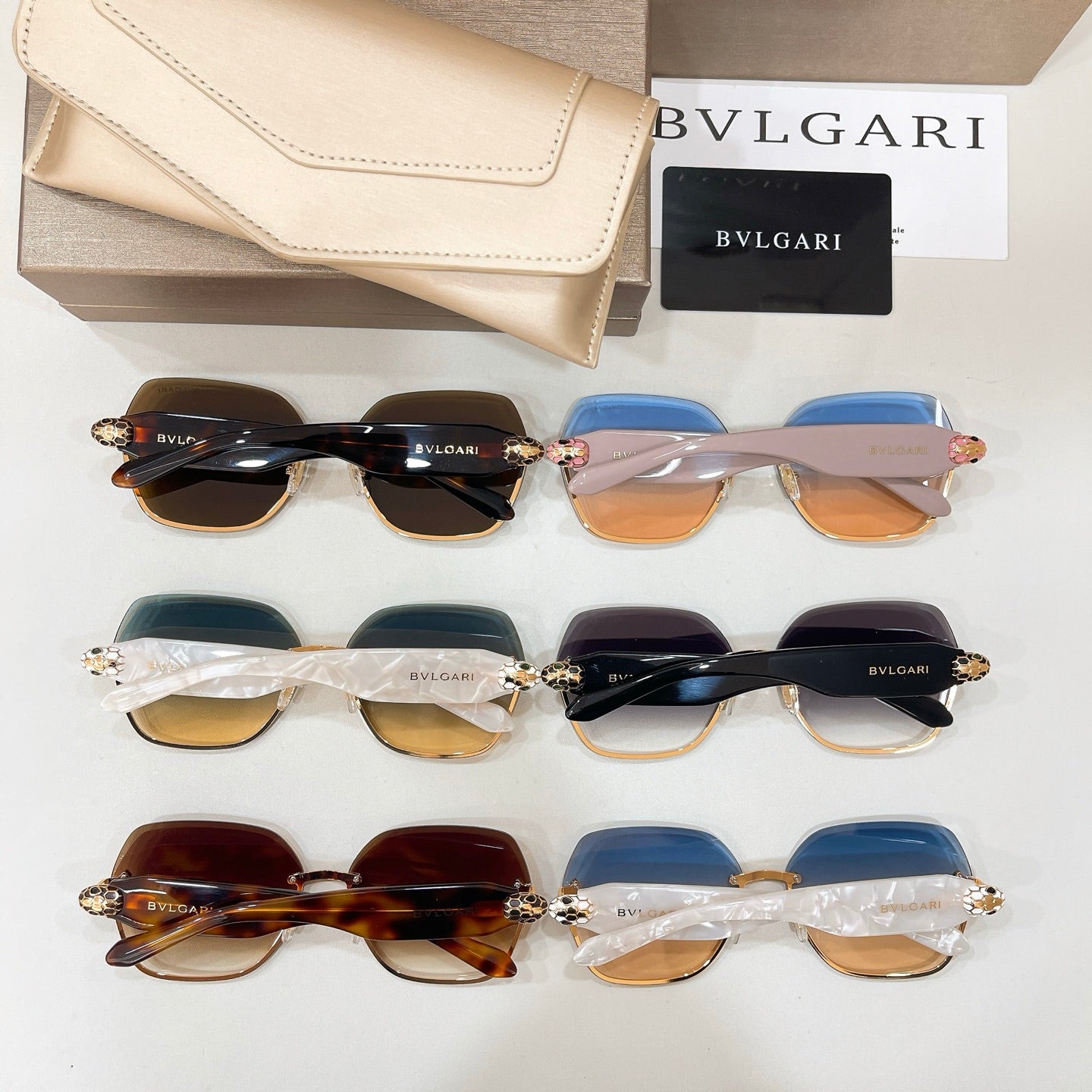 Bvlgari sunglasses set with mixed blue, clear, and amber gradient lenses