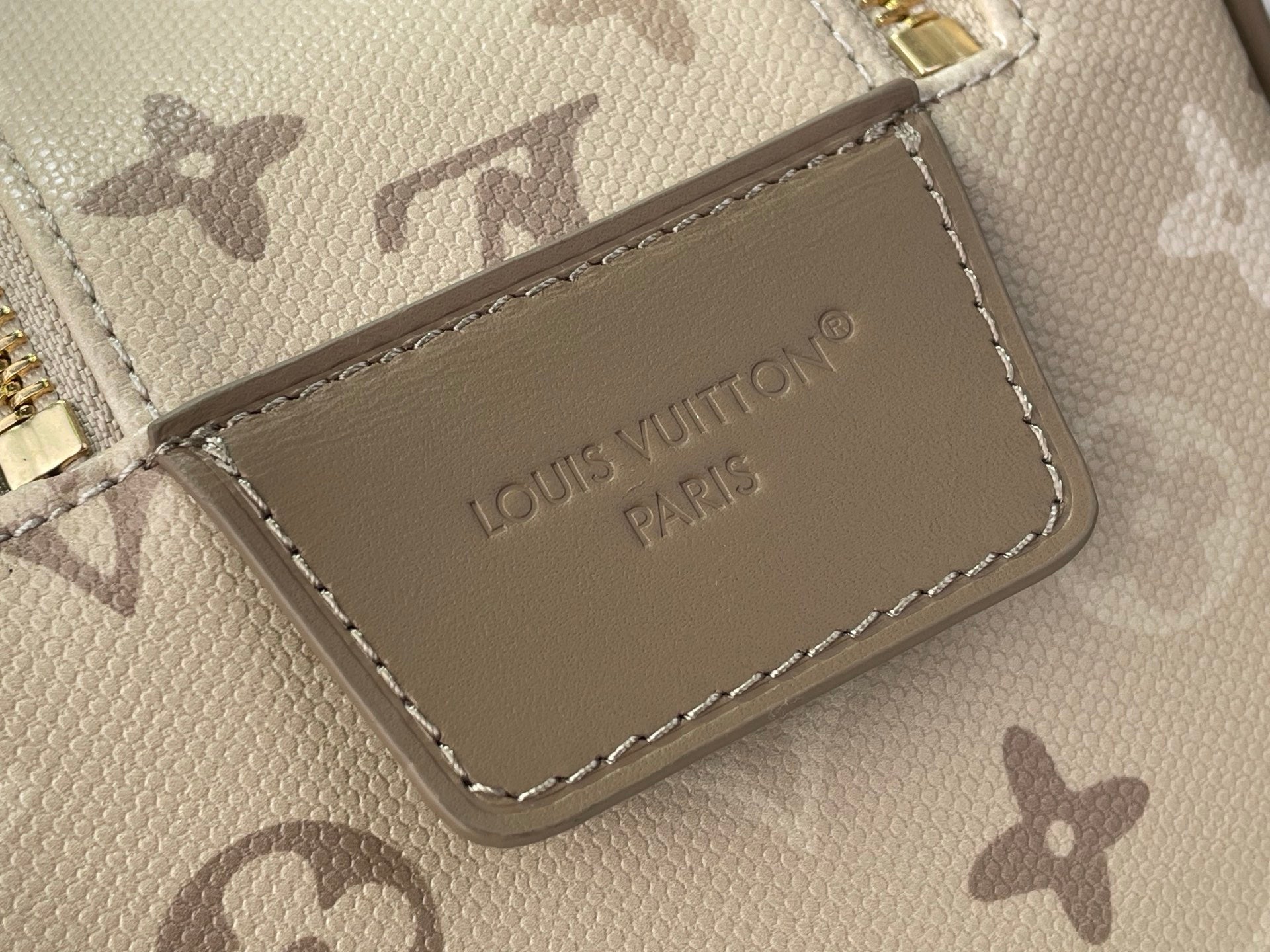 Louis Vuitton monogram bag interior leather patch with embossed brand text