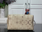 Louis Vuitton monogram canvas bag with wide top opening and tan leather side handle