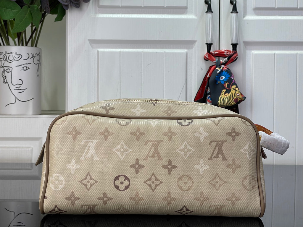 Louis Vuitton monogram canvas bag, tan leather trim, top zip closure