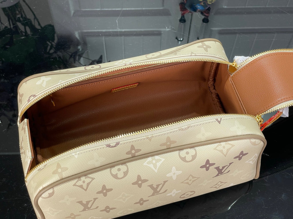 Louis Vuitton monogram bag opened to show tan-lined interior storage compartments