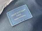 Blue leather label reading Louis Vuitton Paris made in France