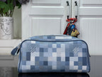 Checkered blue-and-white toiletry bag with top zipper and side handle