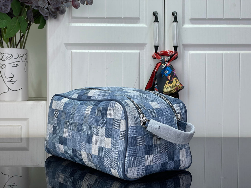 Checkered blue-and-white toiletry bag with curved handle and side zipper
