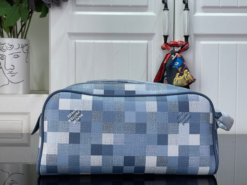 Checkered blue-and-white toiletry bag with zippered top and loop handle