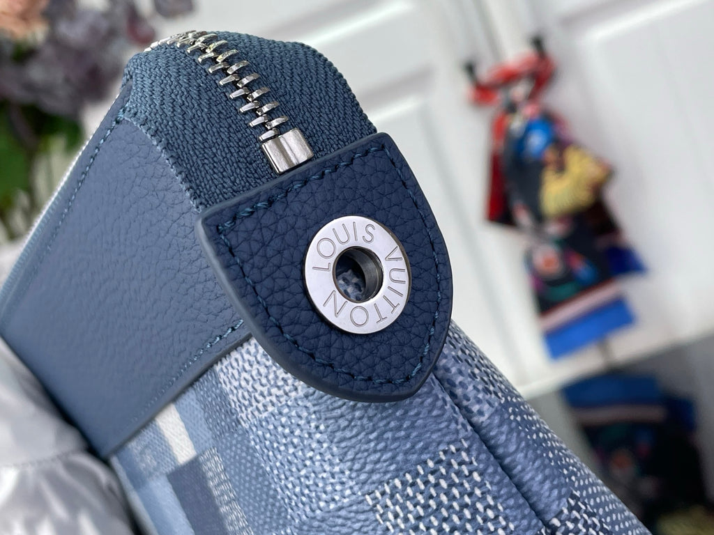 Blue leather zip pull with round Louis Vuitton logo medallion