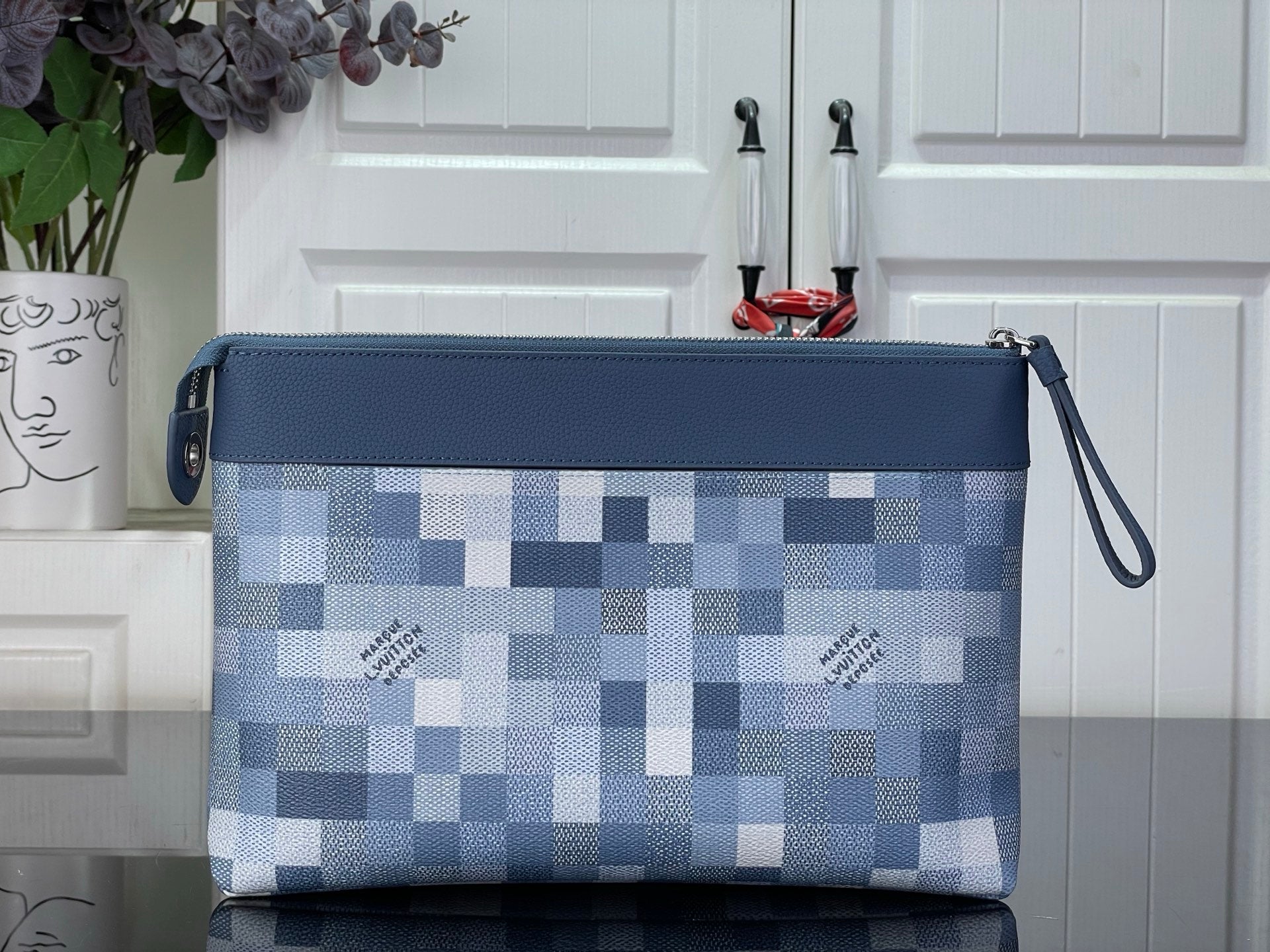 Blue Damier-check zip pouch with top zipper and side wrist strap