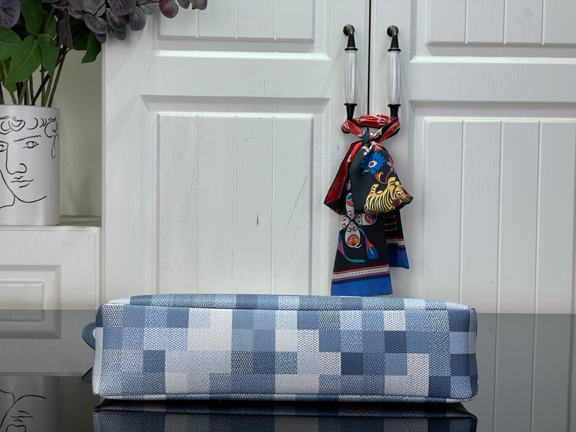 Blue Damier-check pouch with long top zip opening and hanging charm