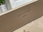 Louis Vuitton Paris embossed on tan leather tab with stitched edge