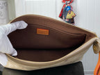 Open top-zip monogram bag with brown fabric lining and small interior label