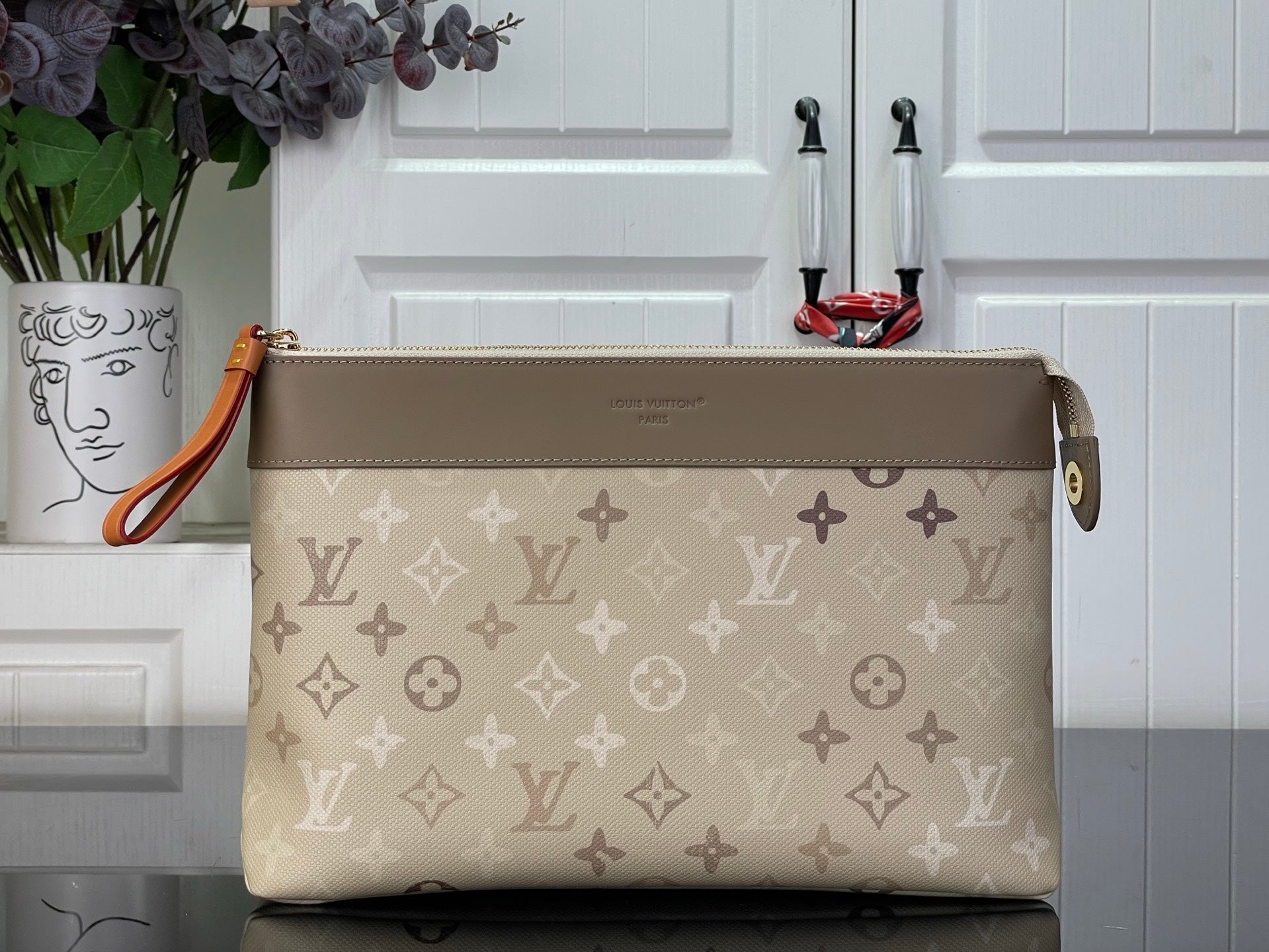Louis Vuitton monogram canvas shoulder bag with top zip and tan leather trim