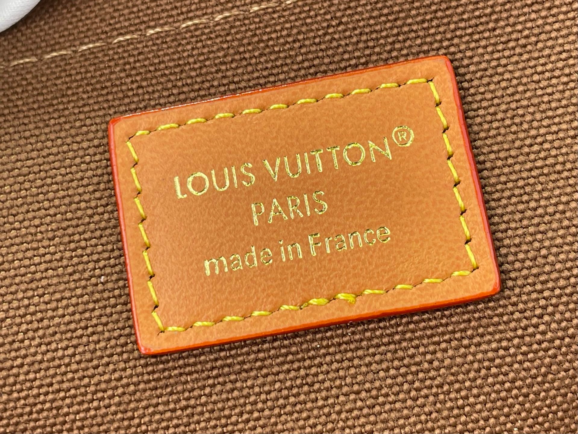 Louis Vuitton Paris "made in France" leather logo patch with yellow stitching
