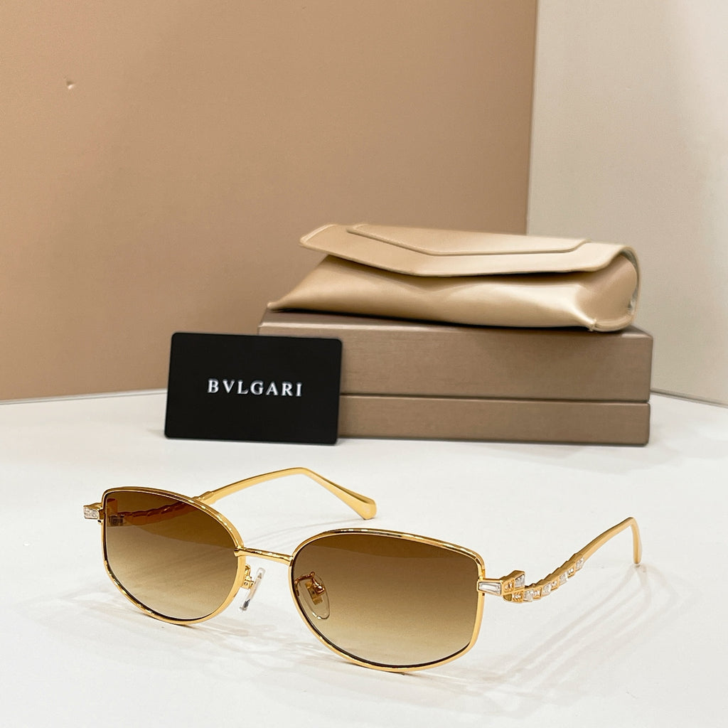 Gold-tone sunglasses with amber lenses, shown with beige case