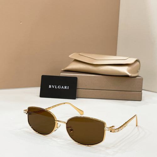 Gold-tone sunglasses with dark lenses, shown with beige case