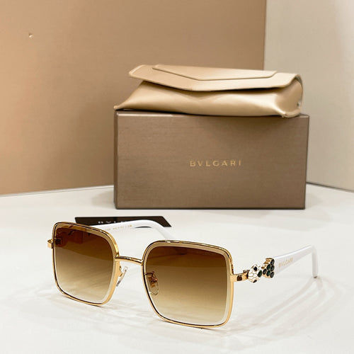 Gold-tone square sunglasses with gradient amber lenses and white temples