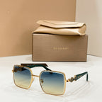 Gold-tone square sunglasses with gradient blue lenses and dark green temples