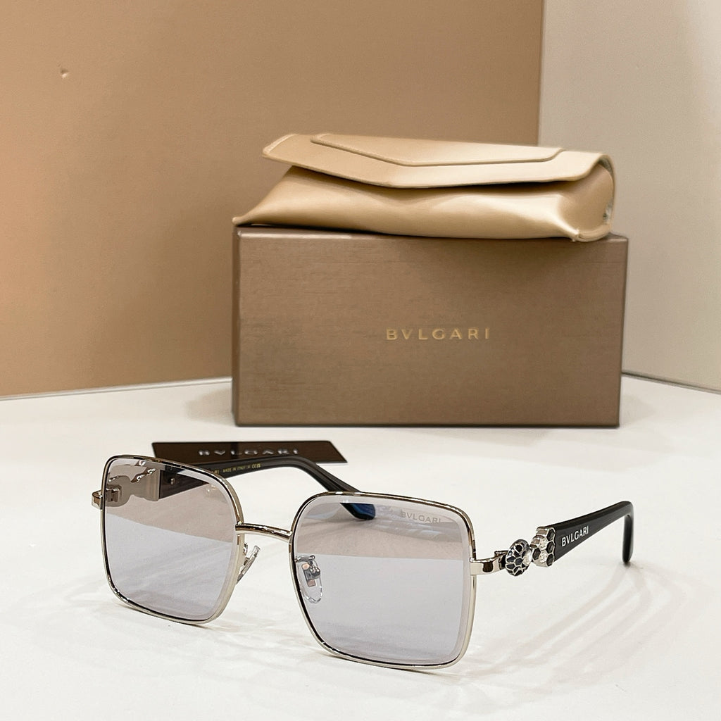 Silver-tone square sunglasses with smoky lenses and jeweled side detail