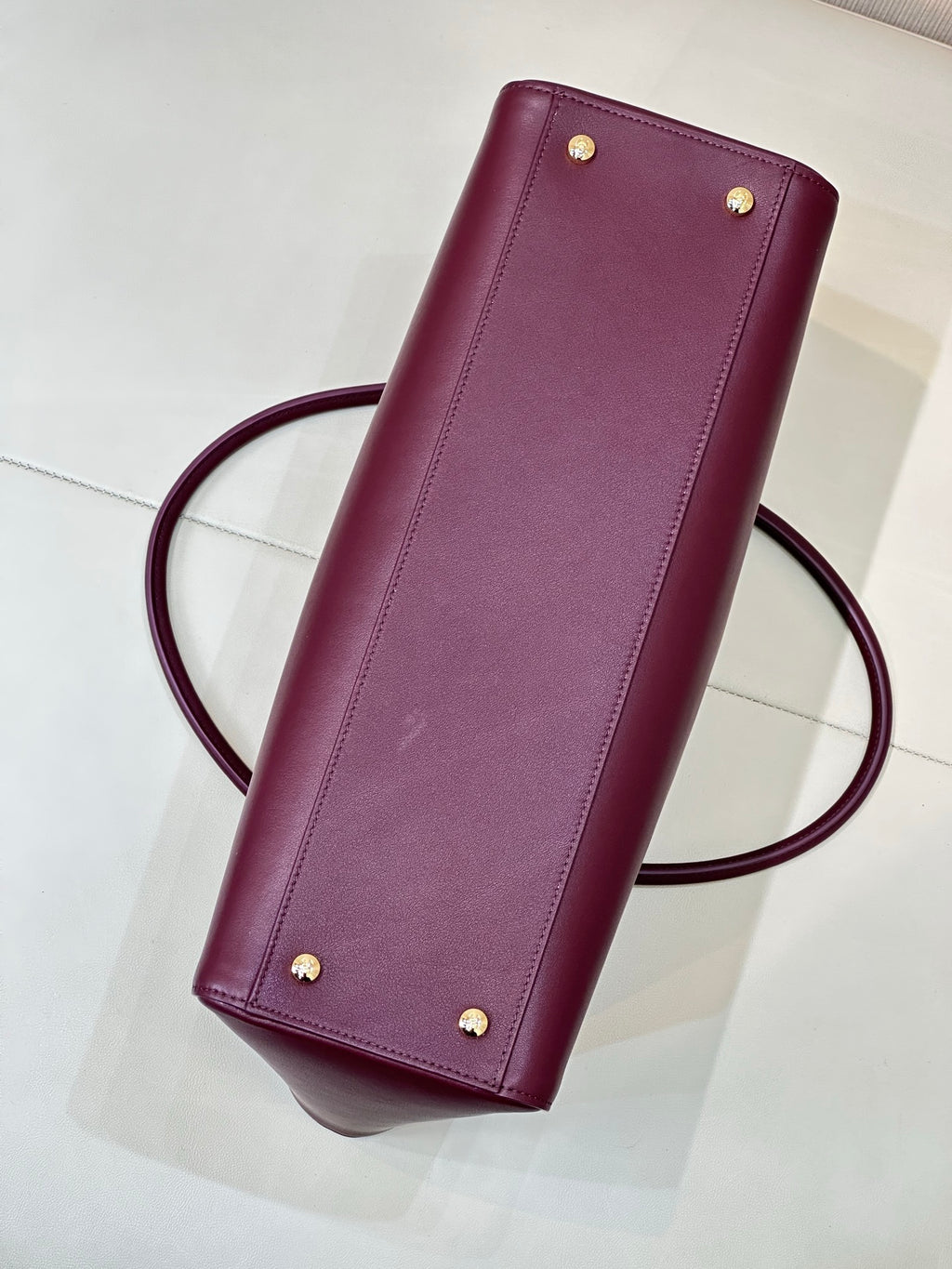 Chanel burgundy leather clutch with corner studs and crossbody strap