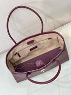 Chanel burgundy leather tote bag interior view with pocket and chain strap