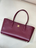 Chanel burgundy leather tote bag with dual top handles and flat base