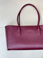 Chanel burgundy leather tote bag front view with top handles