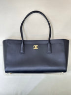 Navy Chanel leather tote bag with gold CC logo and two top handles