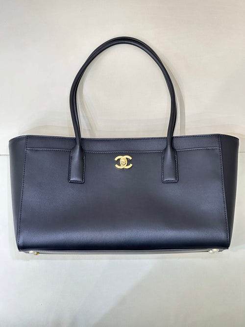 Navy Chanel leather tote bag with gold CC logo and two top handles