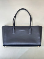 Navy Chanel leather tote bag front view with centered seam and two top handles