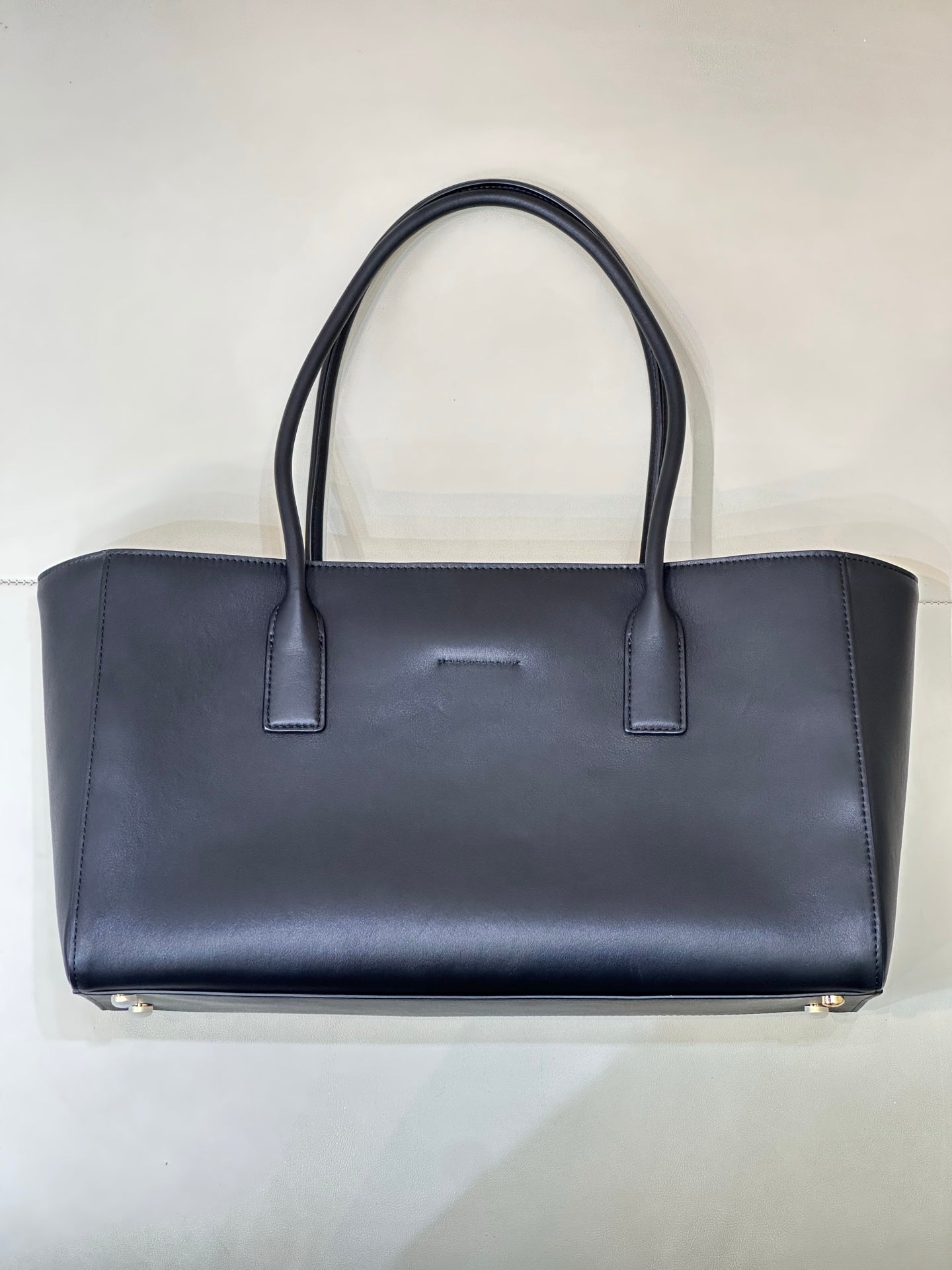 Navy Chanel leather tote bag front view with centered seam and two top handles