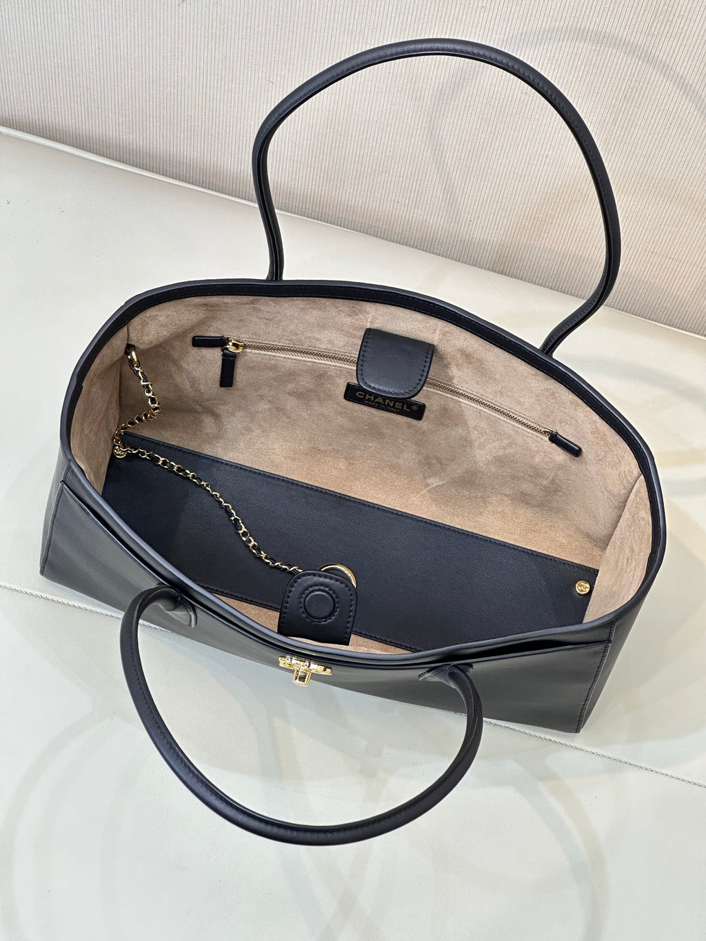 Navy leather tote bag open top with light interior lining and front card holder