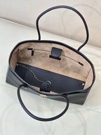 Navy leather tote bag open top with light interior lining and front card holder