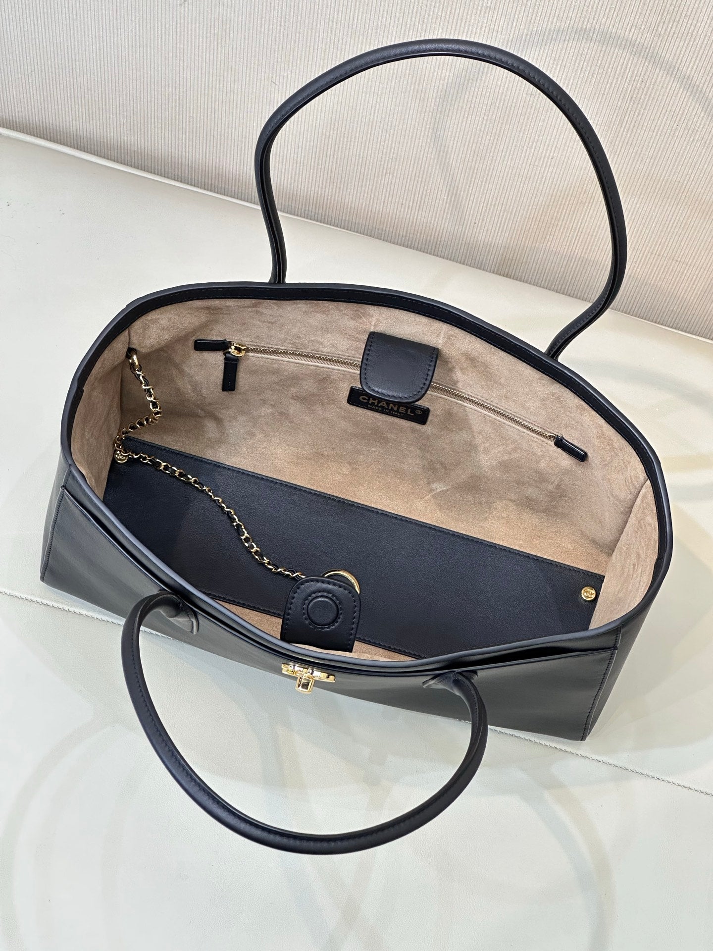 Navy leather tote bag open top with light interior lining and front card holder