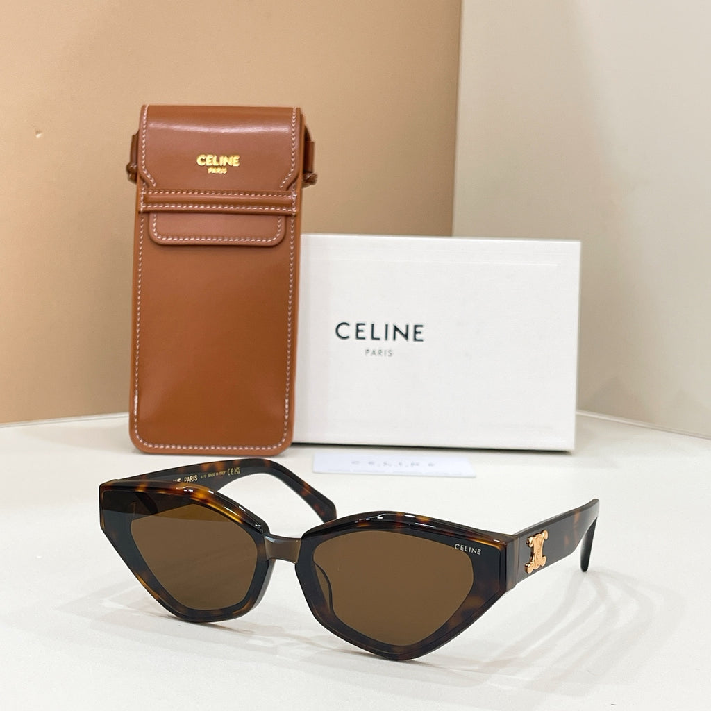 Celine tortoiseshell cat-eye sunglasses with gold logo on temples and tinted lenses