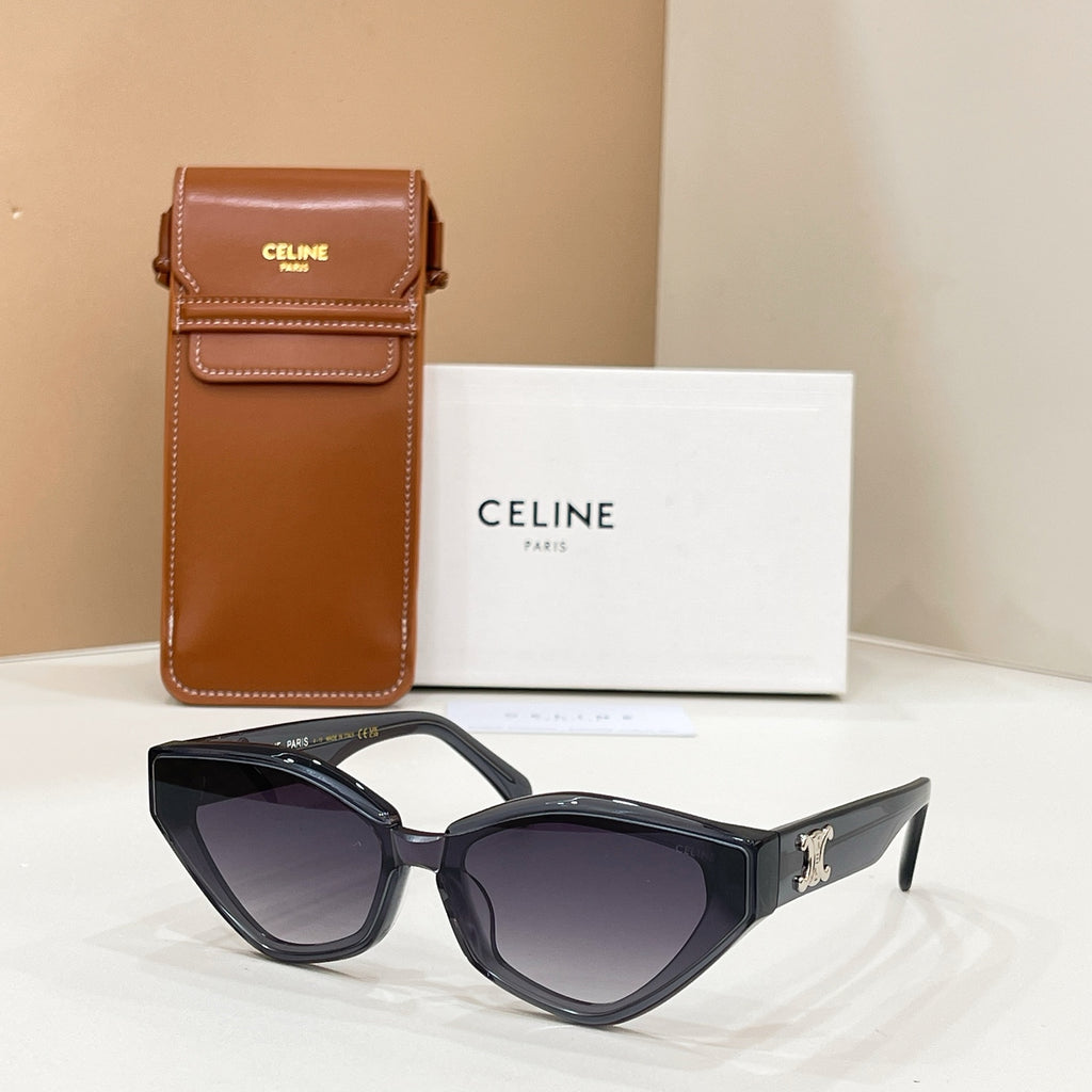 Celine dark cat-eye sunglasses with gold logo on temples and tinted lenses