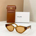 Celine amber cat-eye sunglasses with gold logo on temples and tinted lenses