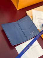 Blue textured leather card holder with two card compartments