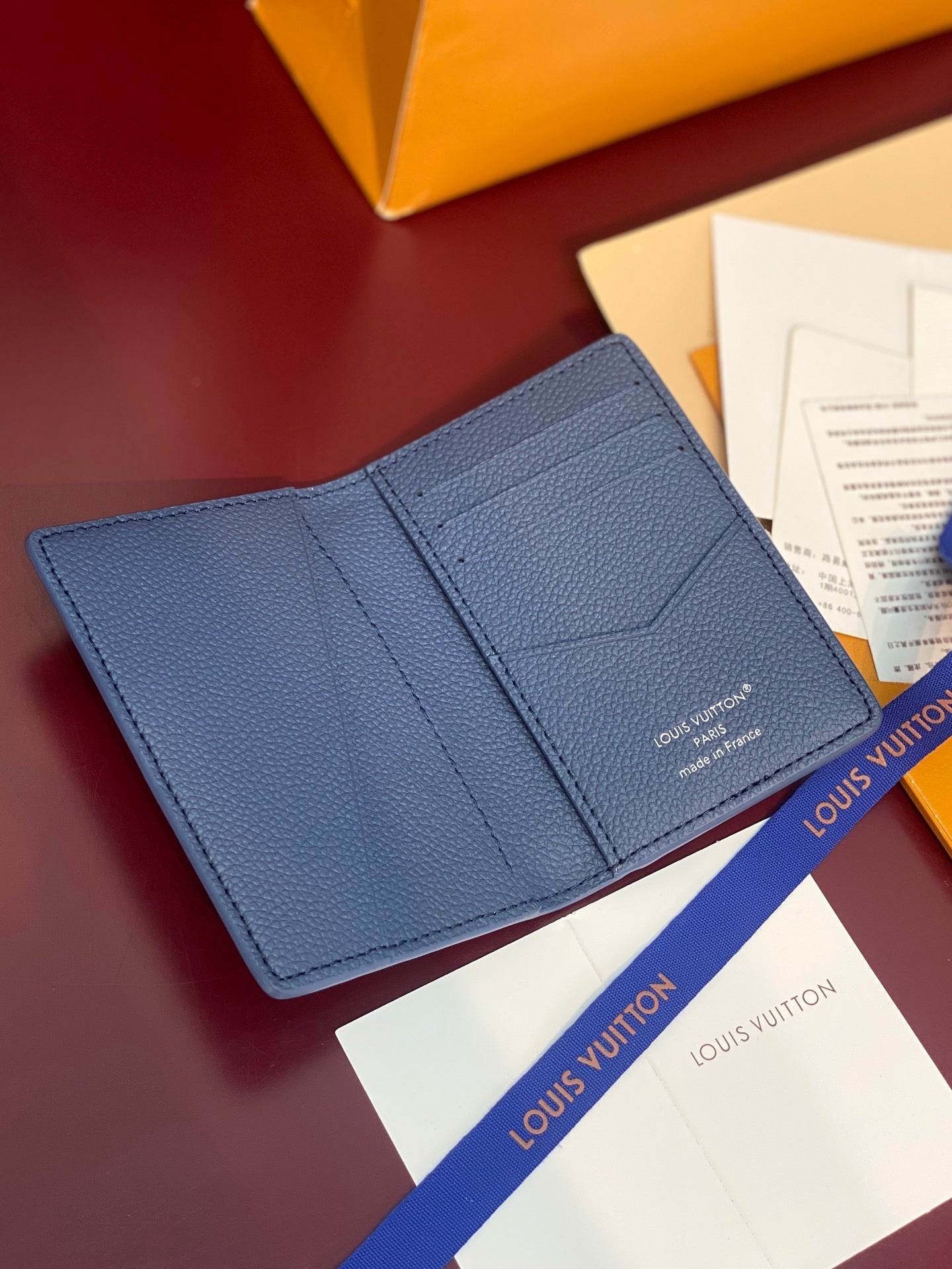 Blue textured leather card holder with two card compartments