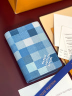 Blue checkered leather card holder with Louis Vuitton script logo