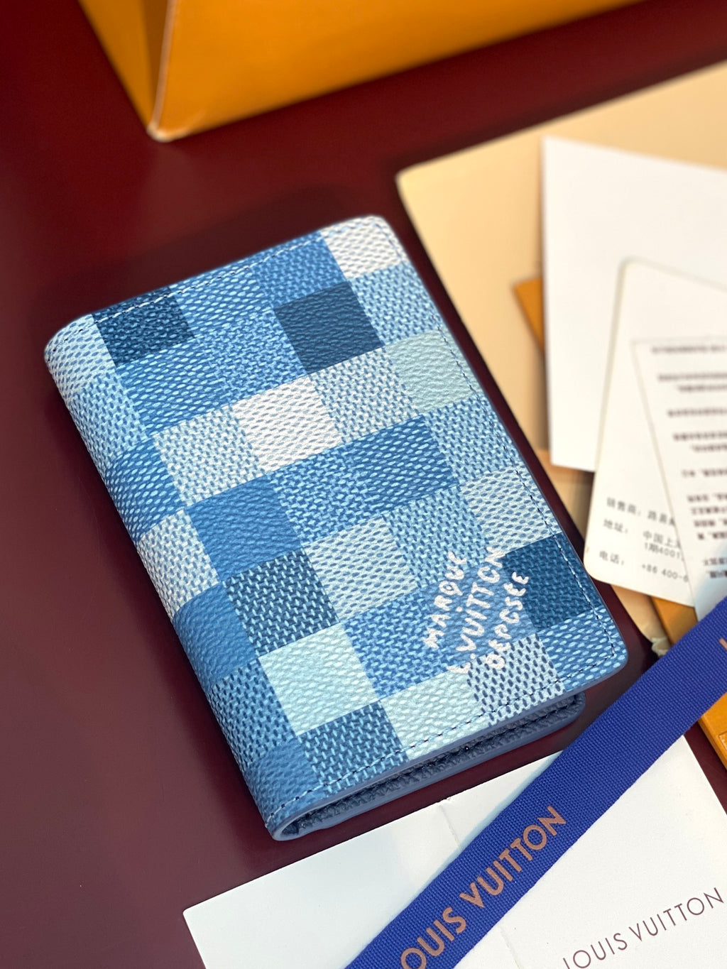 Blue Damier check card holder with Louis Vuitton script logo on front