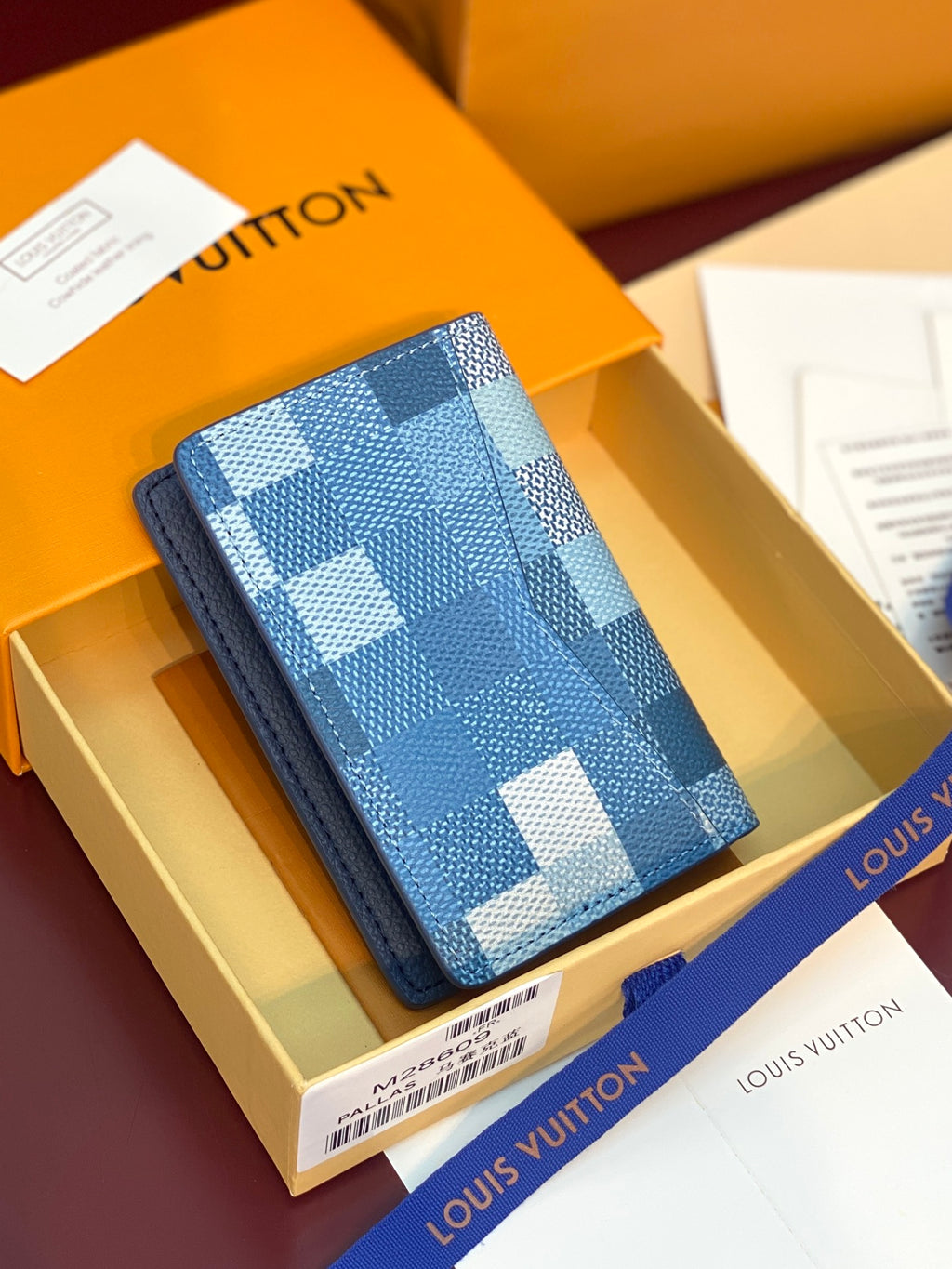 Blue checkered leather card holder with embossed front logo