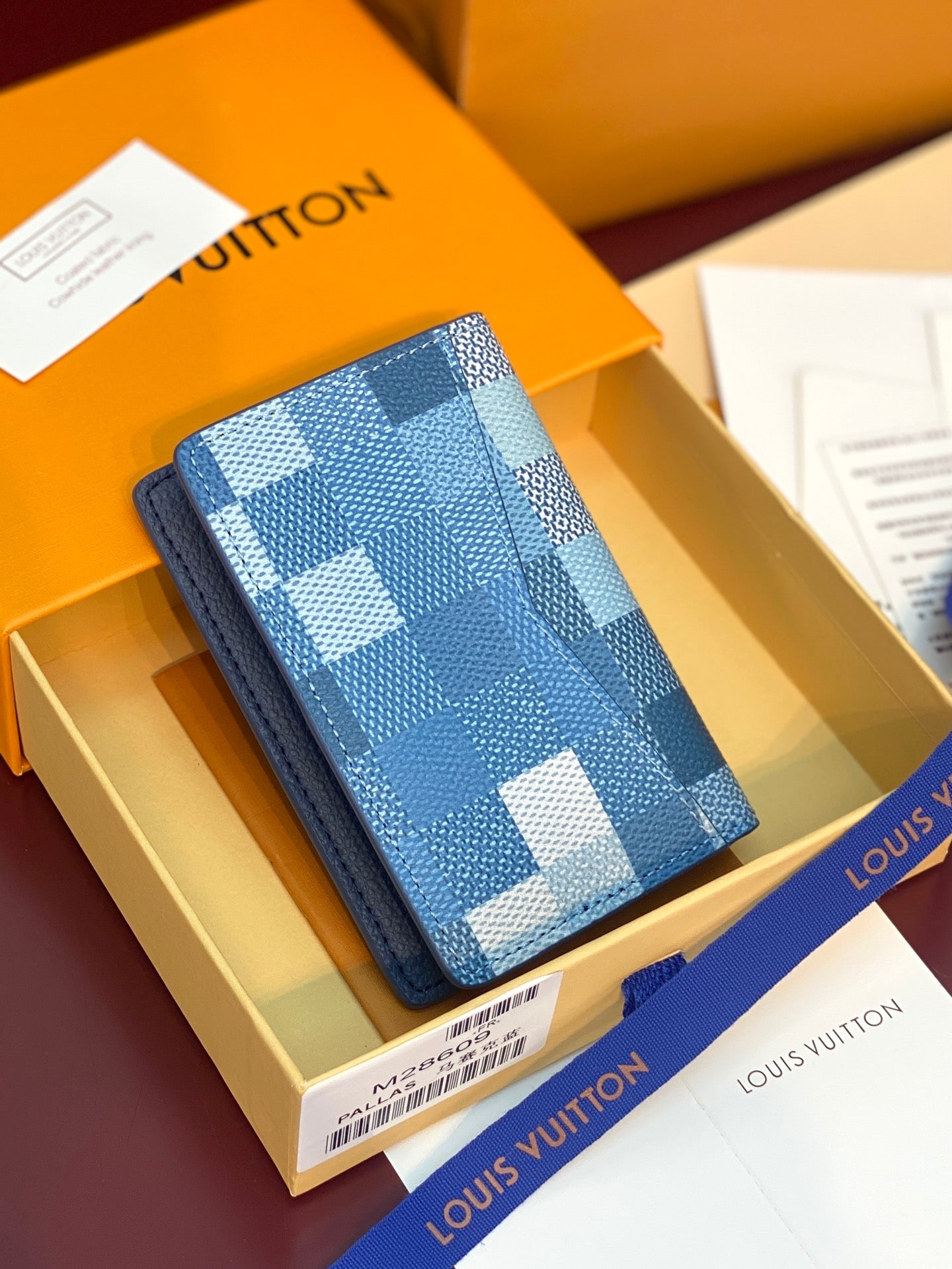 Blue Damier check card holder in box, leather-look texture with stitched edges