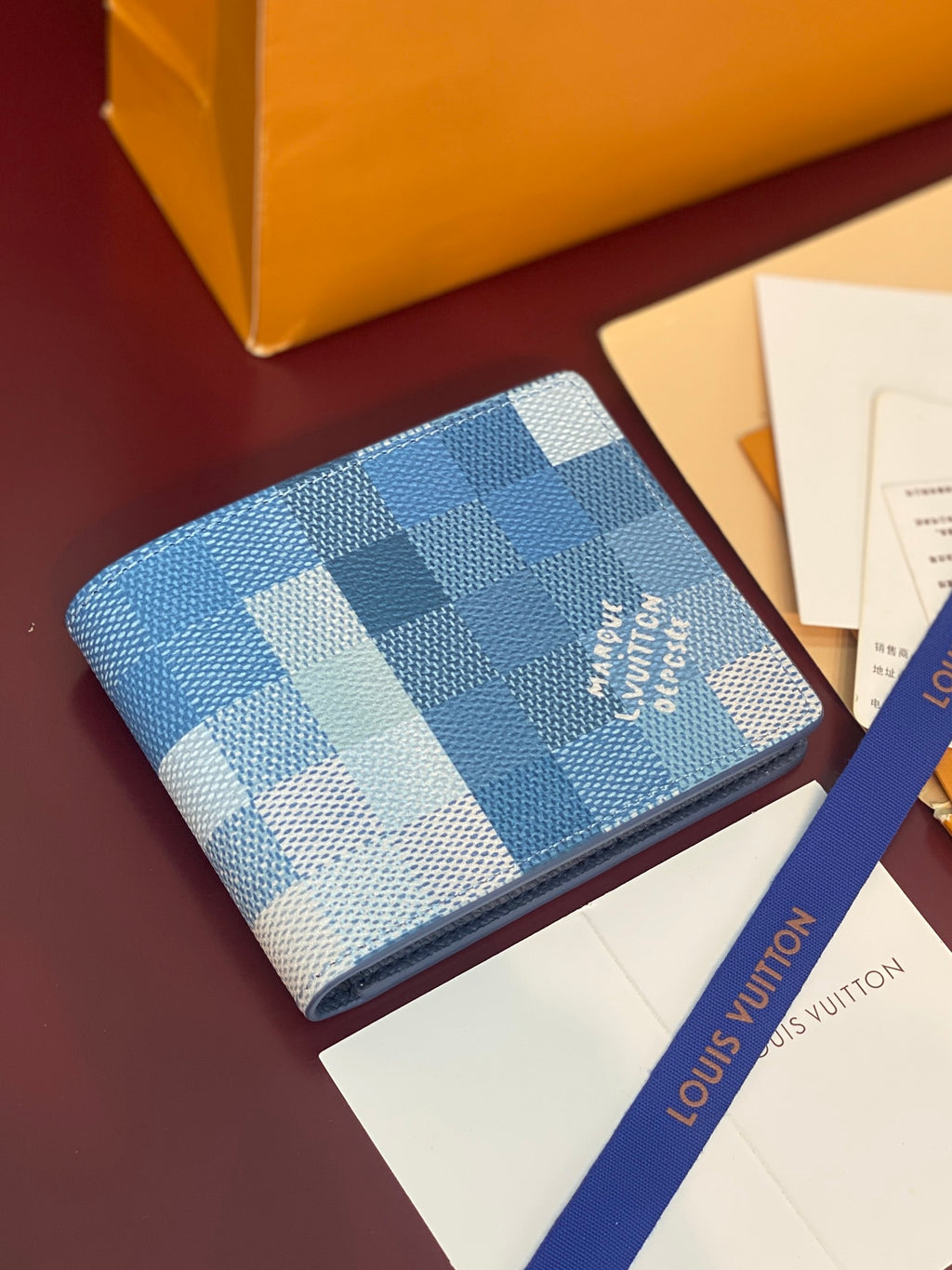Louis Vuitton Damier Azur card holder wallet, blue checkered exterior with logo