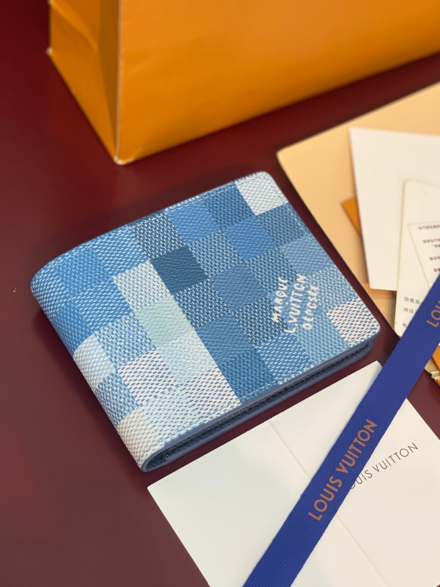 Louis Vuitton Damier Azur card holder wallet, blue checkered exterior with logo