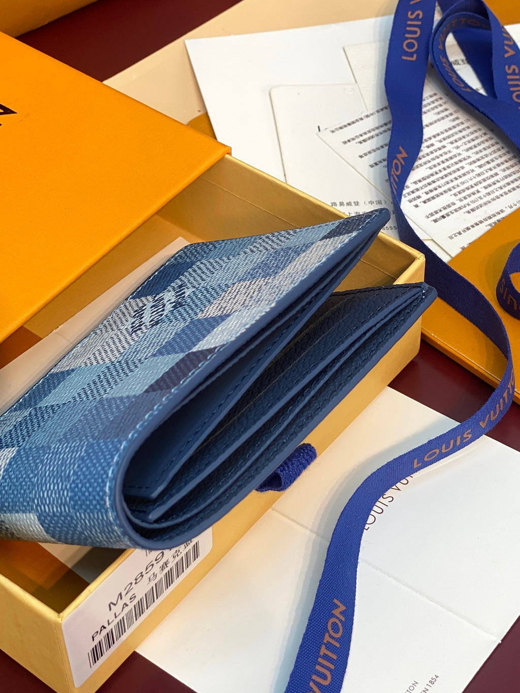 Louis Vuitton small wallet folded out, blue checkered exterior and fabric interior