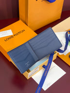 Louis Vuitton blue leather card holder, bifold design with two front card slots